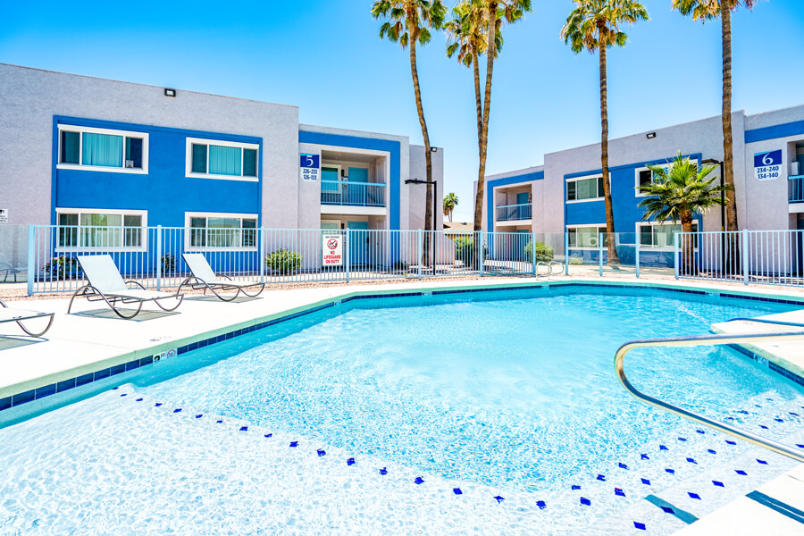 Serena Park Apartments in Phoenix, AZ | Pool photo with apartment building in background